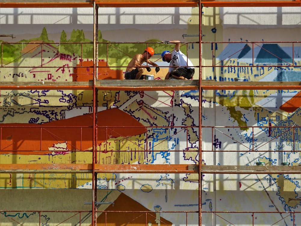 two men working on a scaffolding