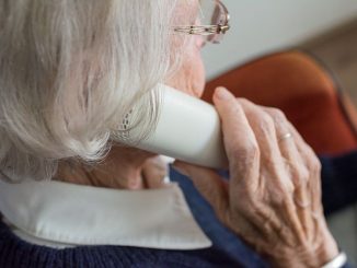 old woman talking to someone over the phone