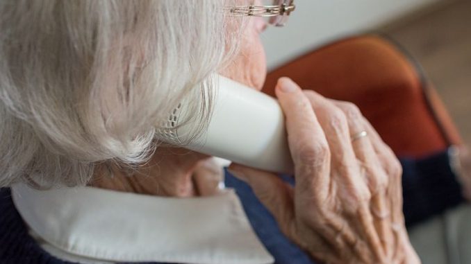 old woman talking to someone over the phone